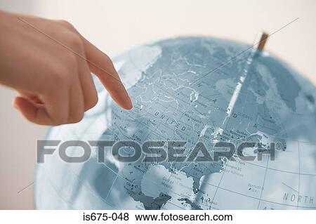 Person pointing at a globe View Large Photo Image Stock Photo - Person pointing at a globe. Fotosearch