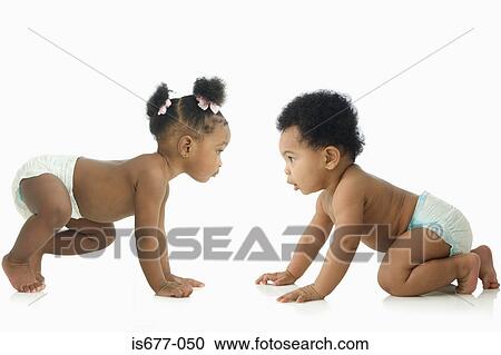 Stock Image - Babies face to face. Fotosearch