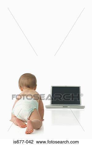 Baby crawling towards laptop View Large Photo Image Stock Image - Baby crawling towards laptop. Fotosearch