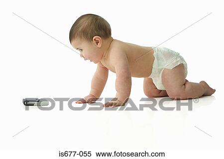 Baby crawling towards mobile phone View Large Photo Image Stock Photography - Baby crawling towards mobile phone. Fotosearch