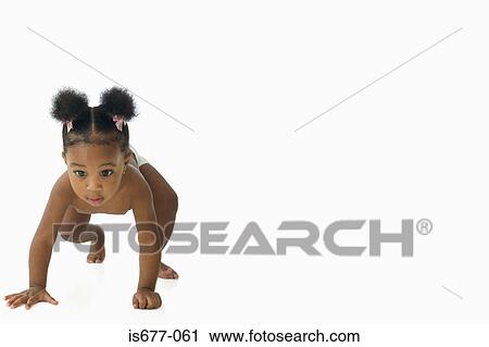 Stock Image - Baby girl crawling . Fotosearch
