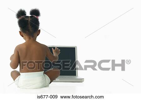 Stock Photo - Baby girl with laptop computer. Fotosearch