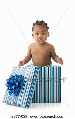 Baby in a gift box View Large Photo Image Stock Photo - Baby in a gift box. Fotosearch