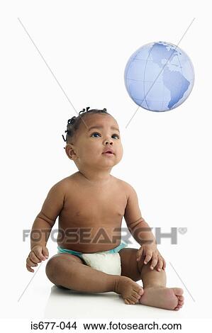 Baby looking at globe View Large Photo Image Picture - Baby looking at globe. Fotosearch