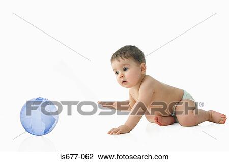 Stock Image - Baby looking at globe. Fotosearch