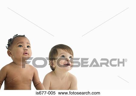 Two babies looking up View Large Photo Image Stock Photography - Two babies looking up. Fotosearch