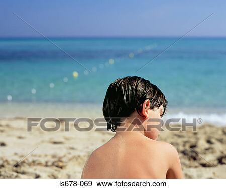 Boy by the sea View Large Photo Image Stock Photo - Boy by the sea. Fotosearch