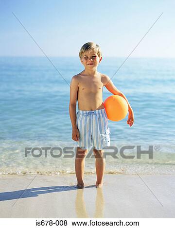 Stock Photo - Boy with a beach ball. Fotosearch
