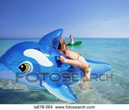 Children in the sea on inflatables View Large Photo Image Picture - Children in the sea on inflatables. Fotosearch