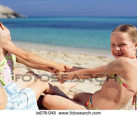 Children playing on the beach View Large Photo Image Stock Photography - Children playing on the beach. Fotosearch