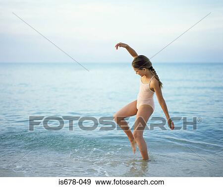 Girl paddling in the sea View Large Photo Image Stock Photo - Girl paddling in the sea. Fotosearch