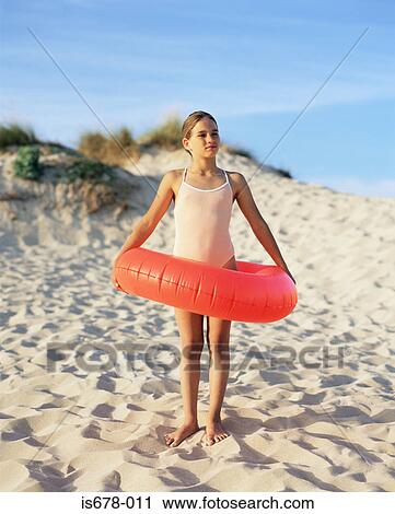 Girl with inflatable ring View Large Photo Image Stock Image - Girl with inflatable ring. Fotosearch