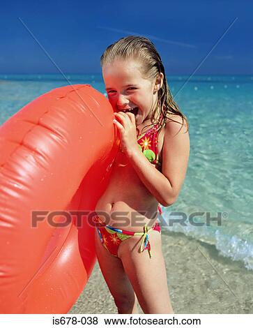 Girl with inflatable ring View Large Photo Image Stock Photo - Girl with inflatable ring. Fotosearch