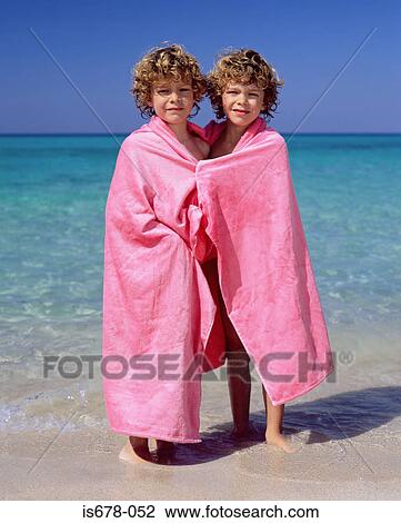 Twins wrapped in pink towels View Large Photo Image Stock Image - Twins wrapped in pink towels. Fotosearch