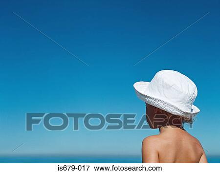 Boy looking out to the horizon View Large Photo Image Stock Photo - Boy looking out to the horizon. Fotosearch