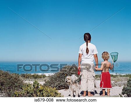 Brother and sister at the coast View Large Photo Image Stock Photo - Brother and sister at the coast. Fotosearch