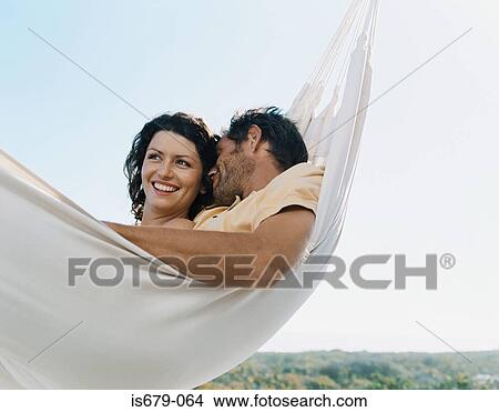 Couple in a hammock View Large Photo Image Picture - Couple in a hammock. Fotosearch