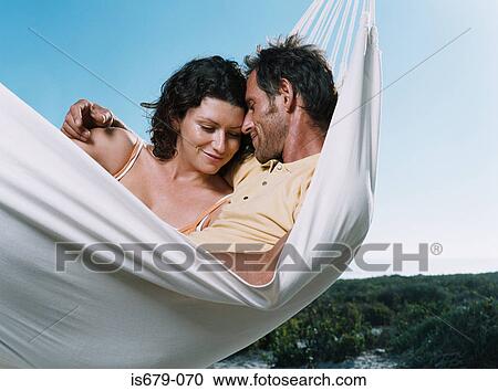 Couple in a hammock View Large Photo Image Stock Image - Couple in a hammock. Fotosearch