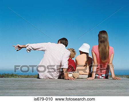 Family looking at sea view View Large Photo Image Stock Image - Family looking at sea view. Fotosearch