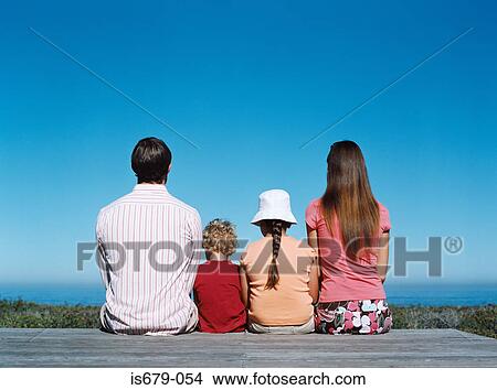 Family looking out to sea View Large Photo Image Picture - Family looking out to sea. Fotosearch