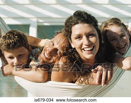 Picture - Family on a hammock. Fotosearch