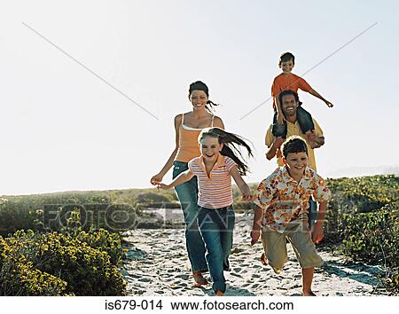 Family running to the beach View Large Photo Image Picture - Family running to the beach. Fotosearch