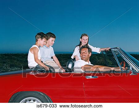 Stock Image - Father taking children on a road trip. Fotosearch