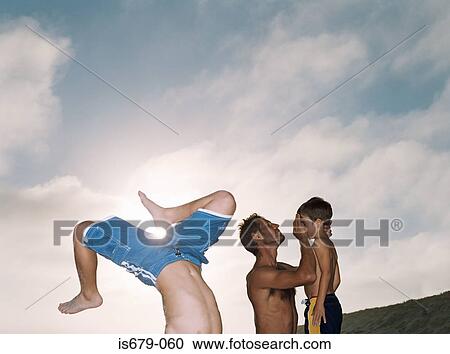 Man helping his injured son View Large Photo Image Stock Image - Man helping his injured son. Fotosearch
