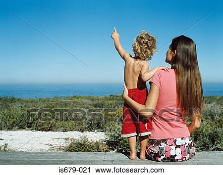 Mother and son looking at view View Large Photo Image Stock Image - Mother and son looking at view. Fotosearch