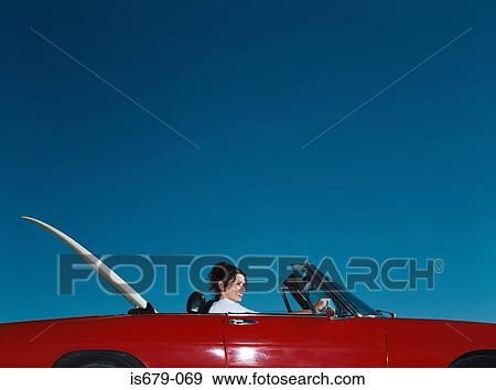 Woman driving convertible View Large Photo Image Stock Photo - Woman driving convertible. Fotosearch