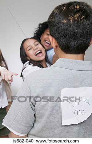 Girls bullying a boy View Large Photo Image Stock Image - Girls bullying a boy. Fotosearch