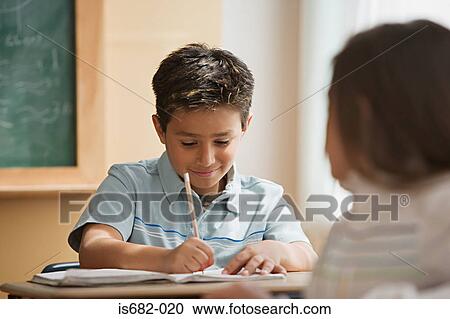 Schoolboy writing View Large Photo Image Stock Image - Schoolboy writing. Fotosearch