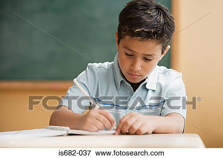 Schoolboy writing View Large Photo Image Stock Photo - Schoolboy writing. Fotosearch