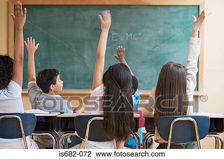Stock Image - Schoolchildren with arms raised. Fotosearch