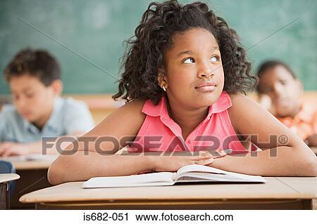 Schoolgirl daydreaming in classroom View Large Photo Image Stock Image - Schoolgirl daydreaming in classroom. Fotosearch