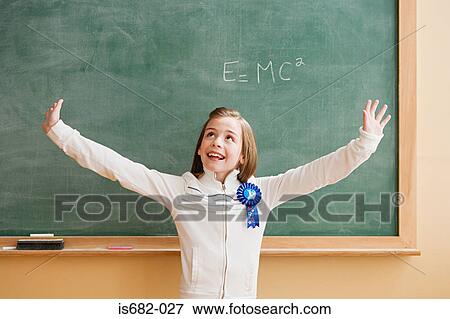 Schoolgirl wearing a rosette View Large Photo Image Stock Photo - Schoolgirl wearing a rosette. Fotosearch