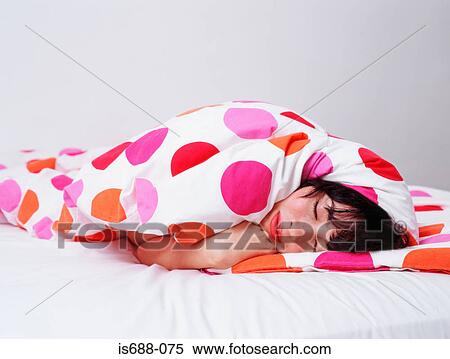Woman sleeping wrapped up in duvet View Large Photo Image Stock Photography - Woman sleeping wrapped up in duvet. Fotosearch