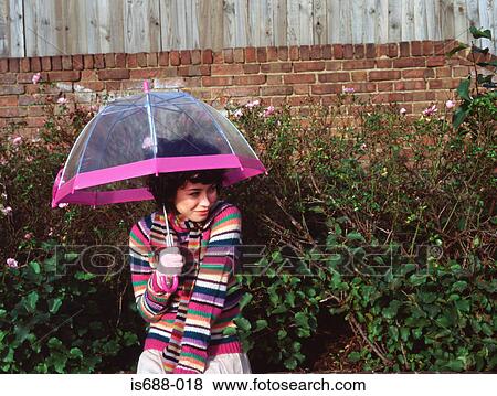 Woman with transparent umbrella View Large Photo Image Stock Photo - Woman with transparent umbrella. Fotosearch