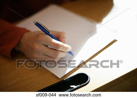 Picture - Person writing notes. Fotosearch
