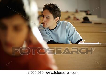 Stock Image - Students in a lecture theatre. Fotosearch