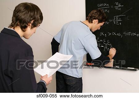 Students working on a maths problem View Large Photo Image Stock Photography - Students working on a maths problem. Fotosearch
