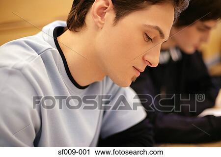 Two young men in a lecture View Large Photo Image Stock Image - Two young men in a lecture. Fotosearch