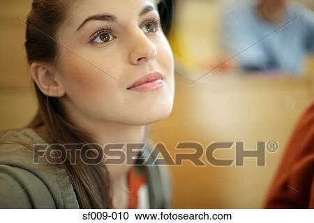 Young woman daydreaming View Large Photo Image Stock Image - Young woman daydreaming. Fotosearch