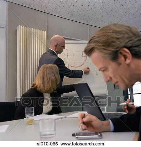 Business people in a presentation View Large Photo Image Stock Photography - Business people in a presentation. Fotosearch