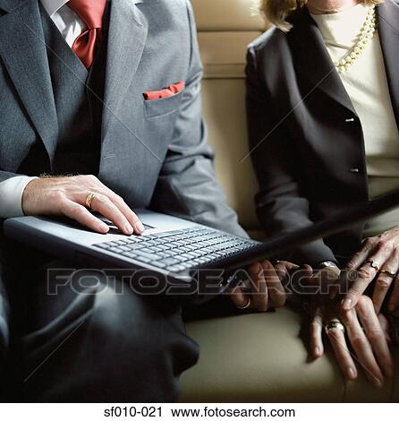 Business people using laptop View Large Photo Image Stock Image - Business people using laptop. Fotosearch