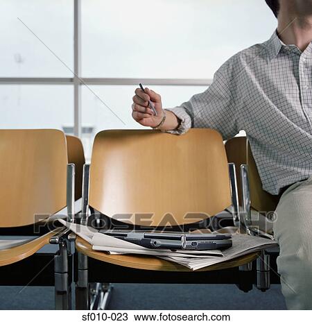 Businessman in departure lounge View Large Photo Image Stock Image - Businessman in departure lounge. Fotosearch