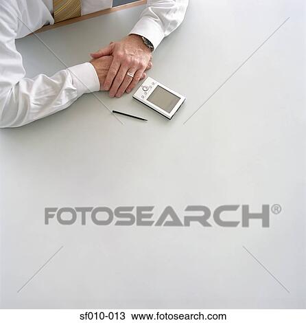 Stock Image - Businessman with palmtop. Fotosearch