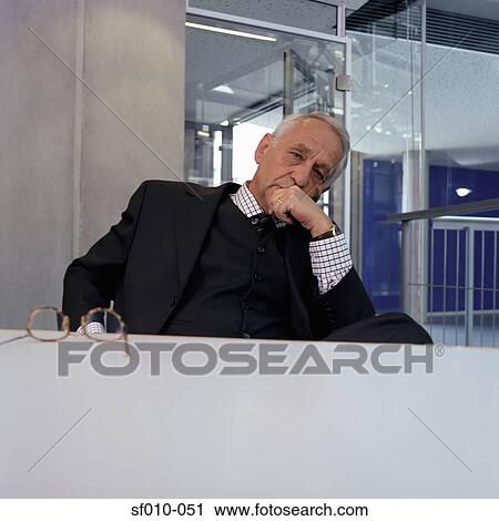 Pensive businessman View Large Photo Image Stock Image - Pensive businessman. Fotosearch