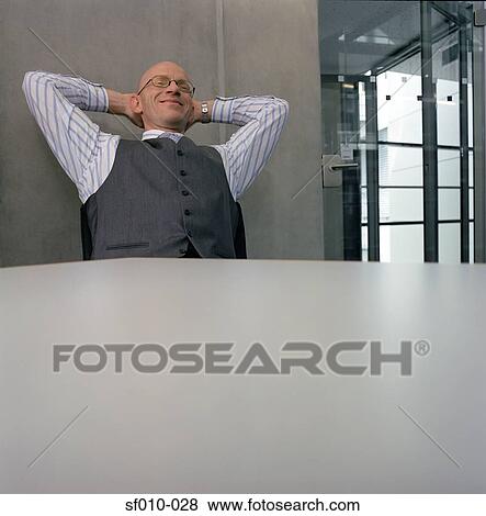 Satisfied businessman View Large Photo Image Stock Photo - Satisfied businessman. Fotosearch
