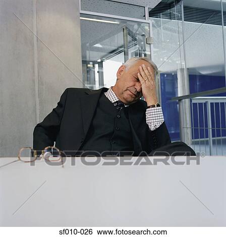 Stock Photograph - Tired businessman. Fotosearch